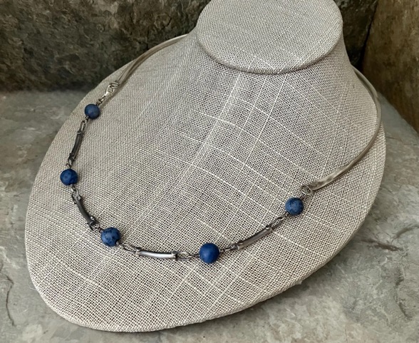 Handmade rustic silver necklace with spaced out blue beads